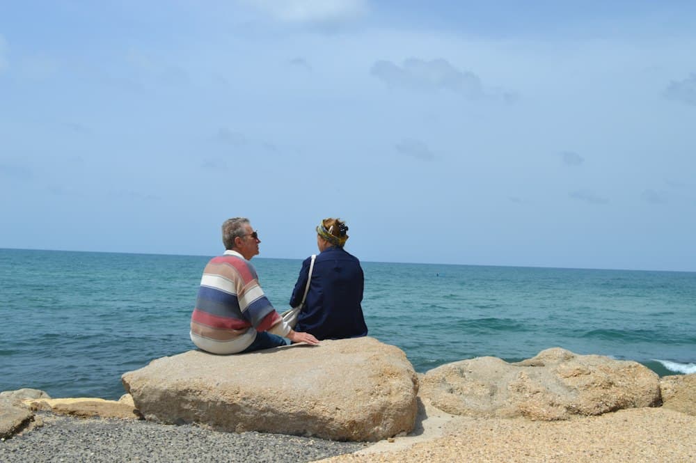 Retired couple relaxing by the ocean